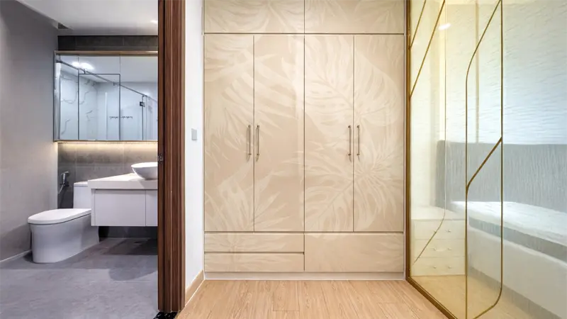 Modern wardrobe with latte beige floral laminate sheet design creating an elegant and stylish bedroom interior