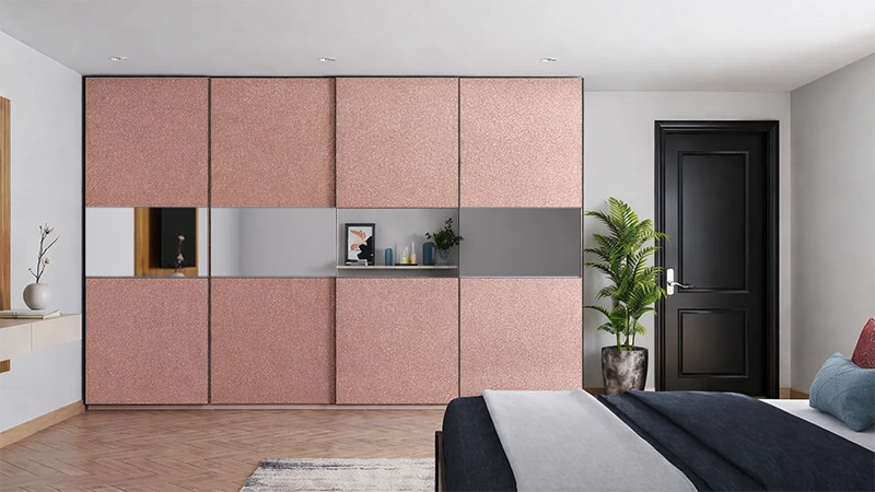 Sliding wardrobe with metallic rose gold sparkly laminate sheet and mirror panel creating a luxurious modern bedroom interior